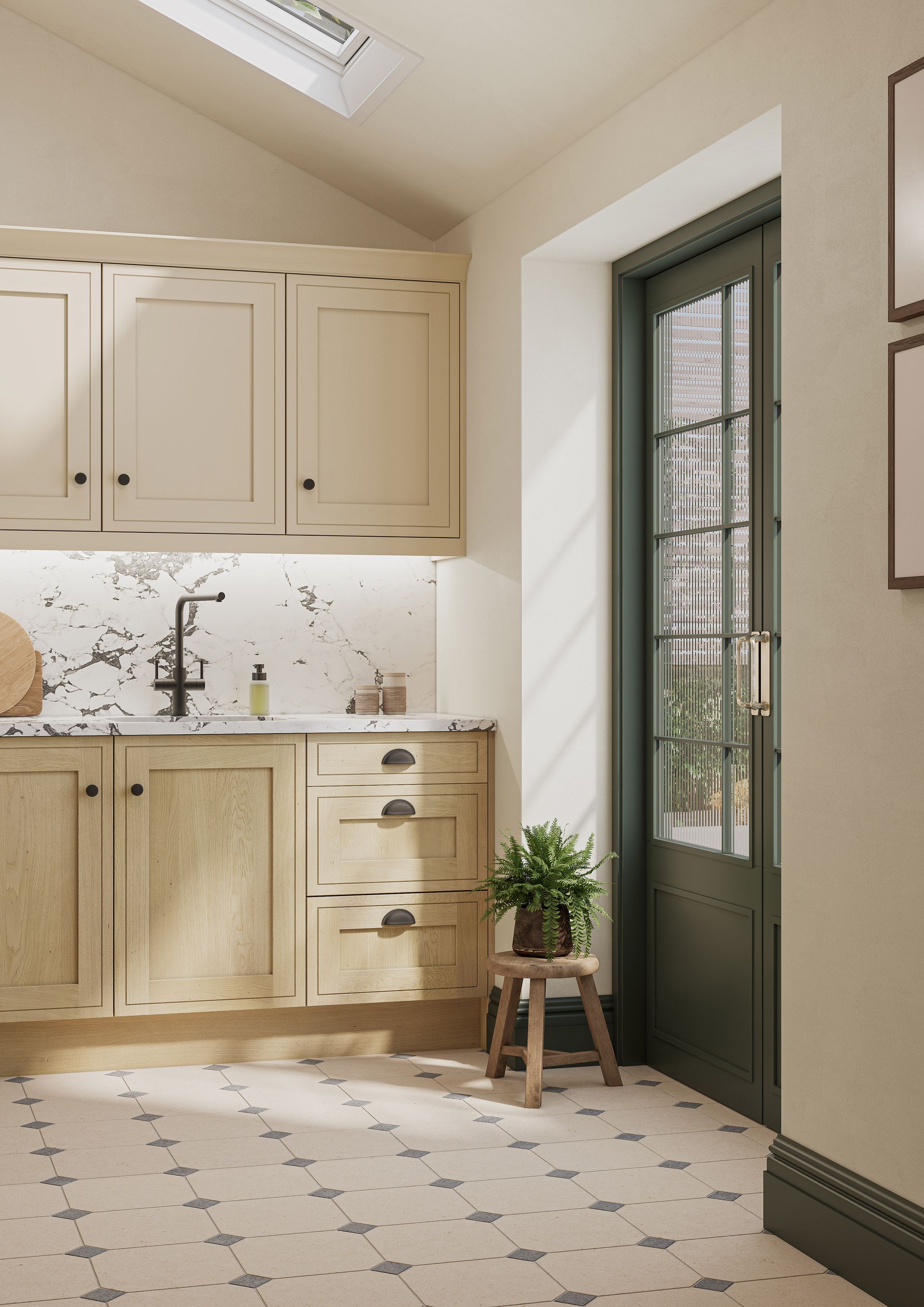A kitchen with beige cabinets, a patterned backsplash, and a dark green door, illuminated by a skylight above.