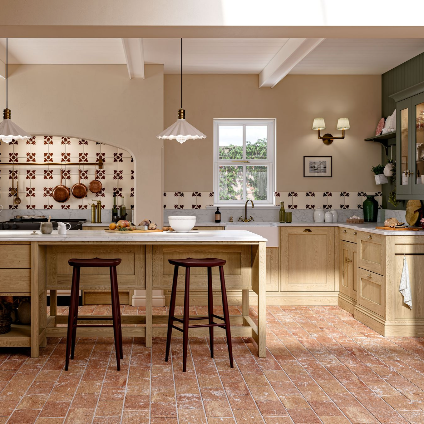 A rustic kitchen featuring wooden cabinets, a large island with two stools, terracotta tile floors, and patterned tiles.
