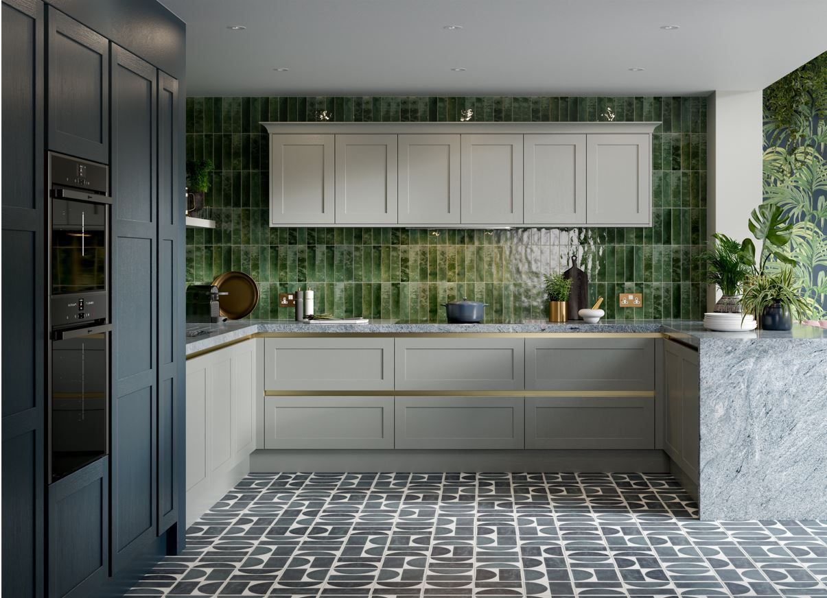 Modern kitchen with dark navy cabinets, light grey cupboards, green tiled backsplash, and patterned monochrome flooring.