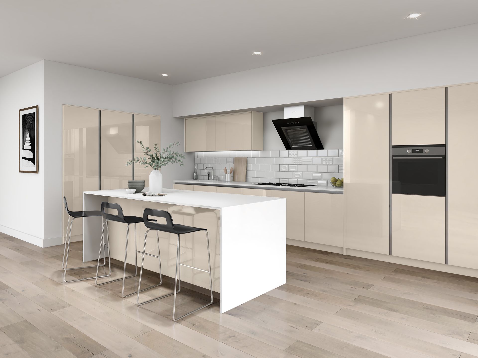 Modern kitchen with a white island, three black stools, cream-colored cabinetry, and light wood flooring.