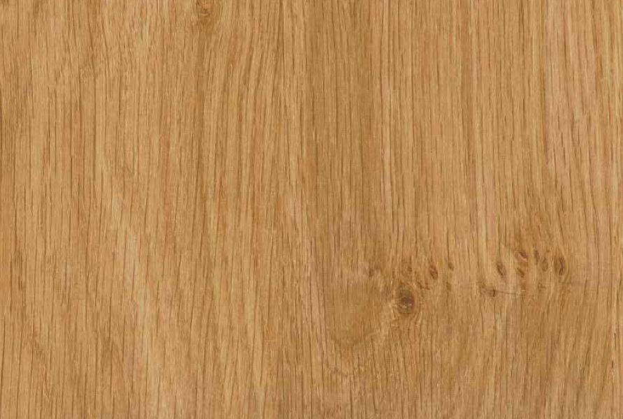 A close-up of a light brown wood grain texture with vertical patterns and subtle knots.