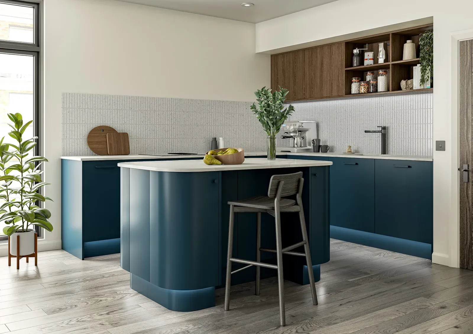 Modern kitchen with a dark teal curved island, wood-toned cabinetry, light countertops, and a single bar stool.