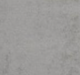 A plain, uniform background with a light grey, slightly mottled or textured concrete-like surface.