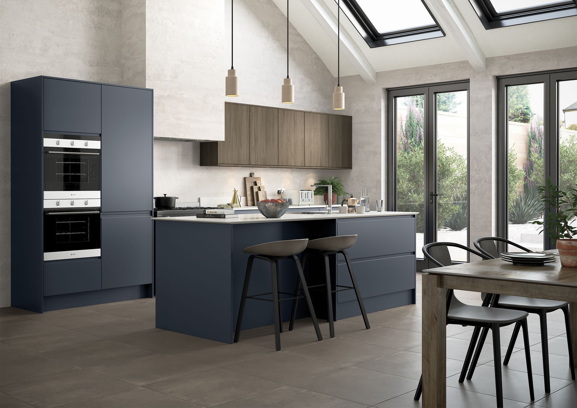 A modern kitchen featuring a dark blue island with stools, wooden cabinets, and a tall oven unit in a bright, airy space.