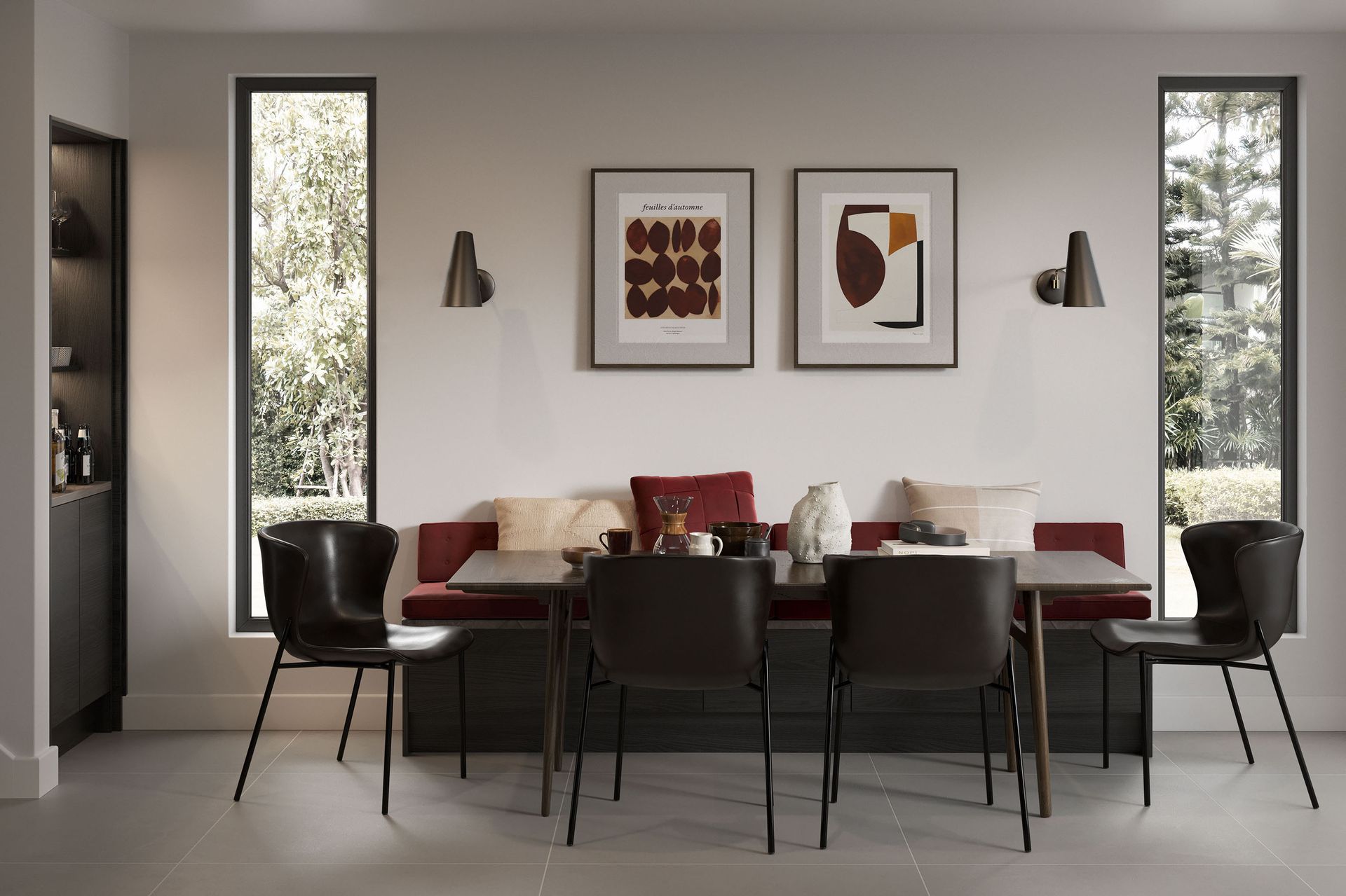 A dining nook with a long burgundy bench, a dark wooden table, four black chairs, and two framed abstract art prints.