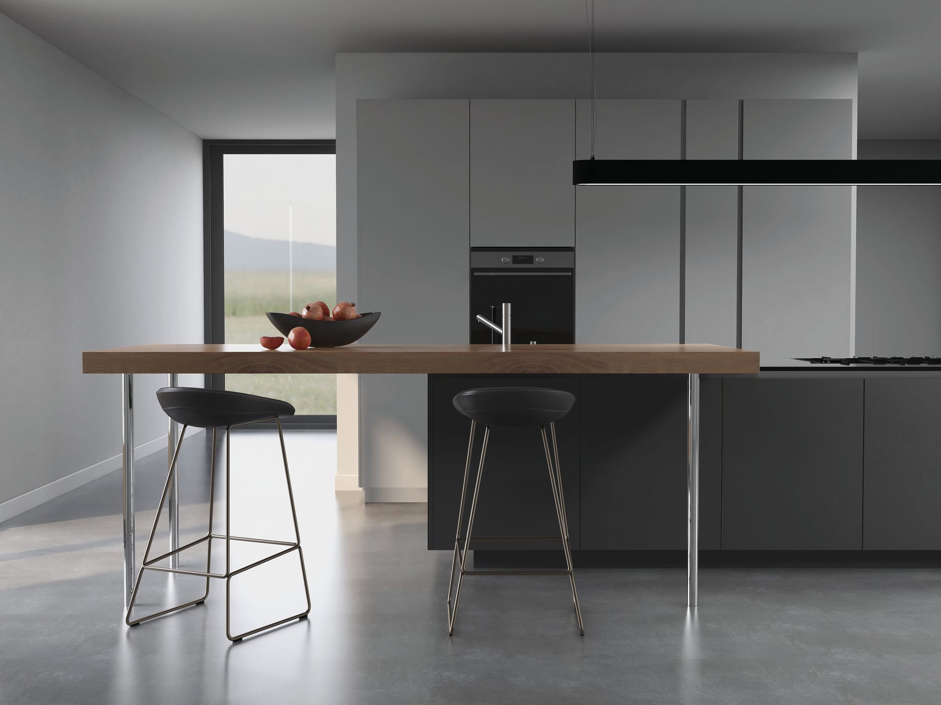 A minimalist kitchen featuring a dark island with a long wooden breakfast bar and two bar stools in a gray, modern space.