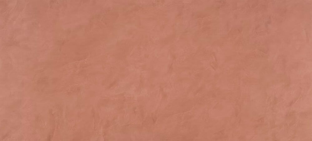 A solid, matte terracotta-colored background with subtle, mottled plaster-like texture.
