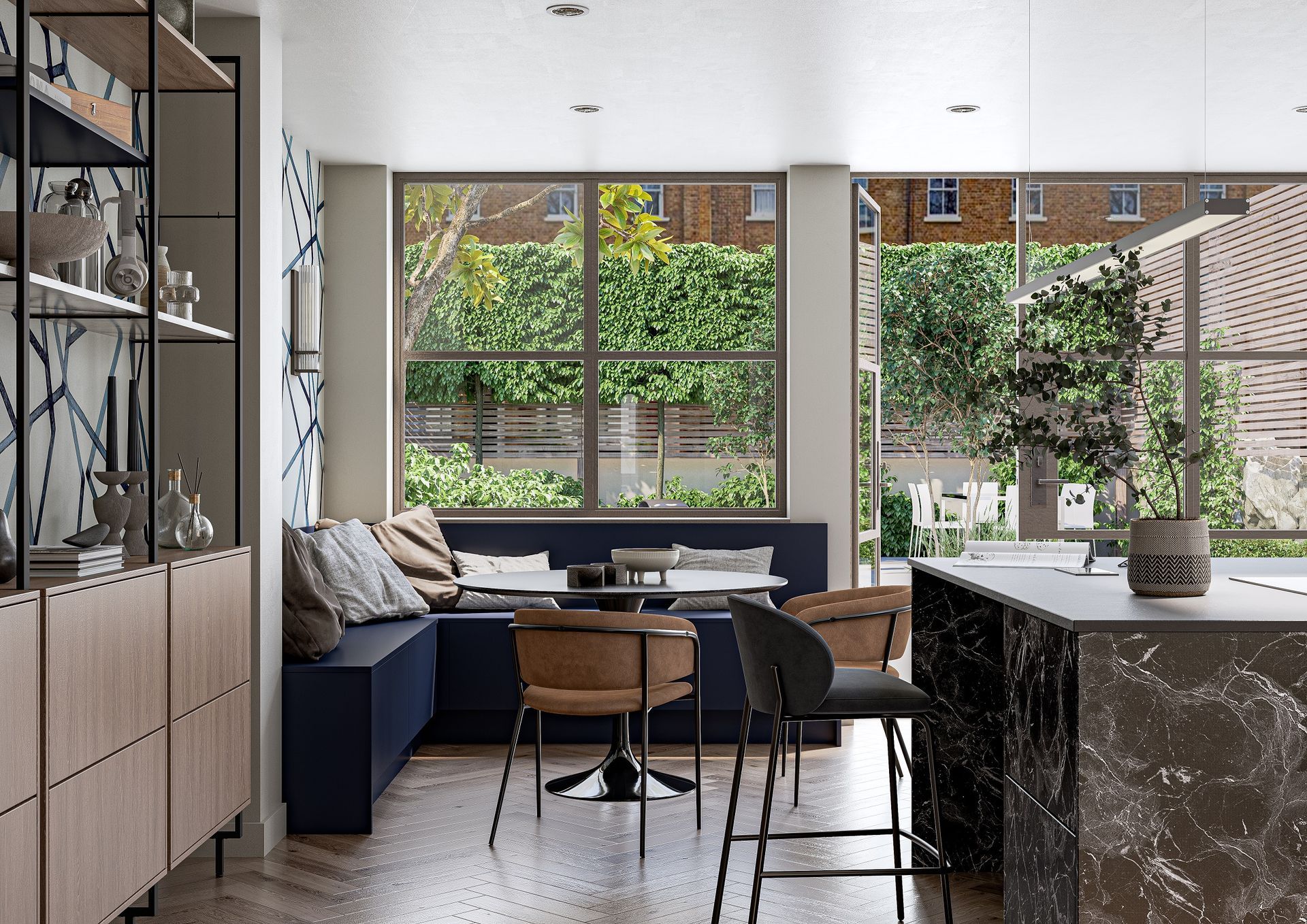 A modern dining nook with a blue L-shaped bench, a round table, brown chairs, and a marble kitchen island in the foreground.