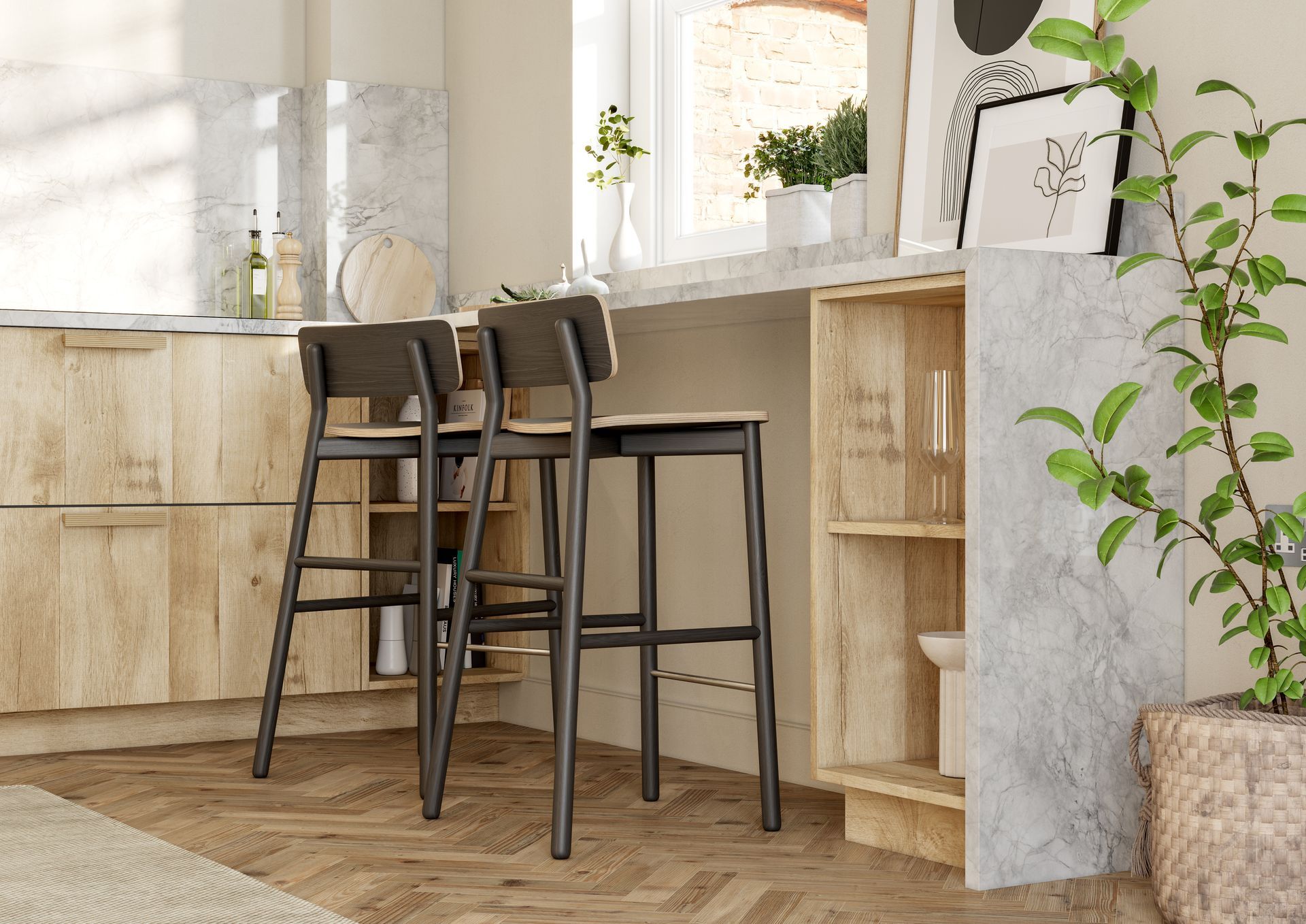 Two dark-framed bar stools sit at a stone-topped kitchen island with light wood cabinetry and a nearby potted plant.
