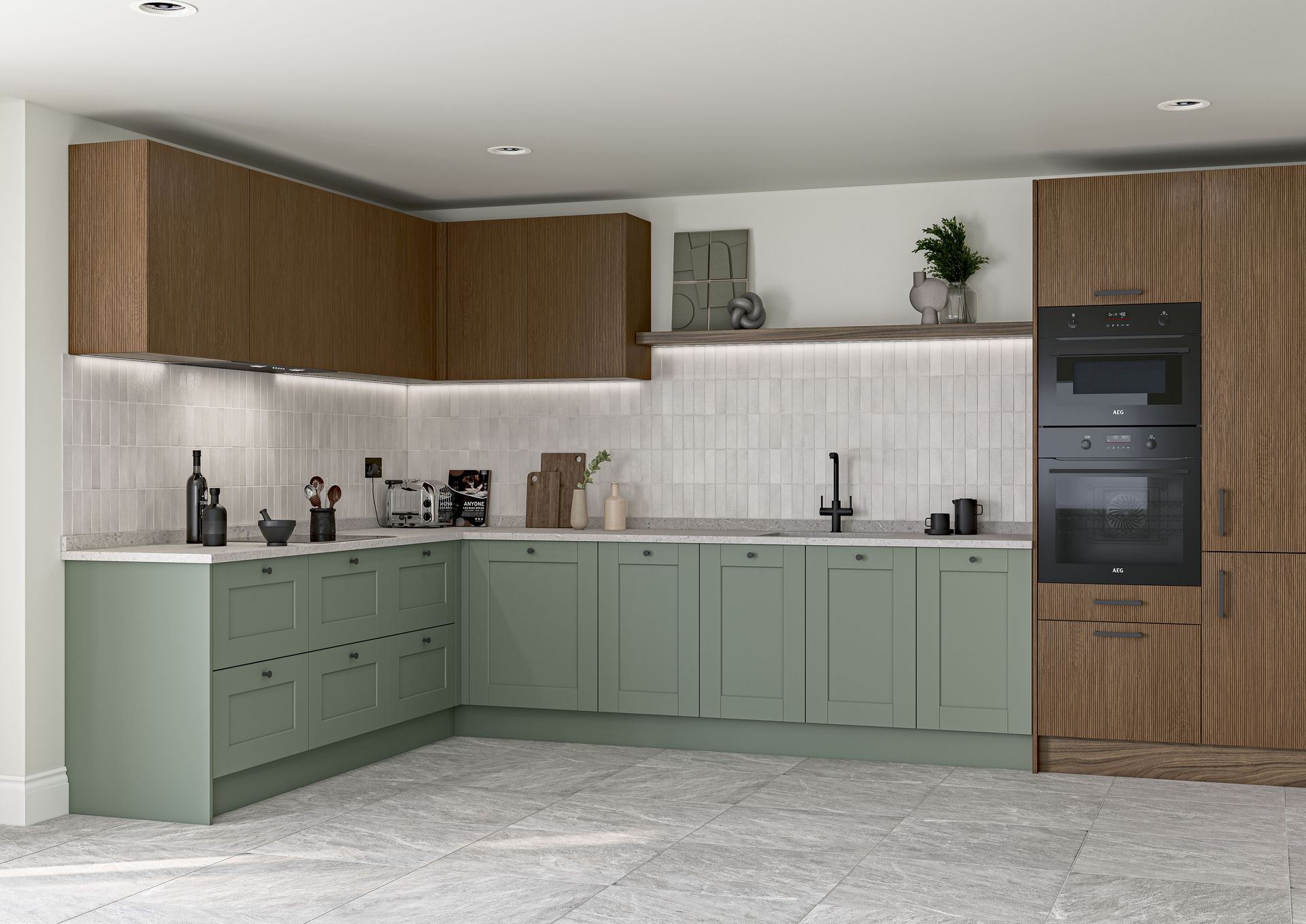 L-shaped kitchen with sage green cabinets, wood-grain wall cabinets, white countertops, and a built-in double oven.