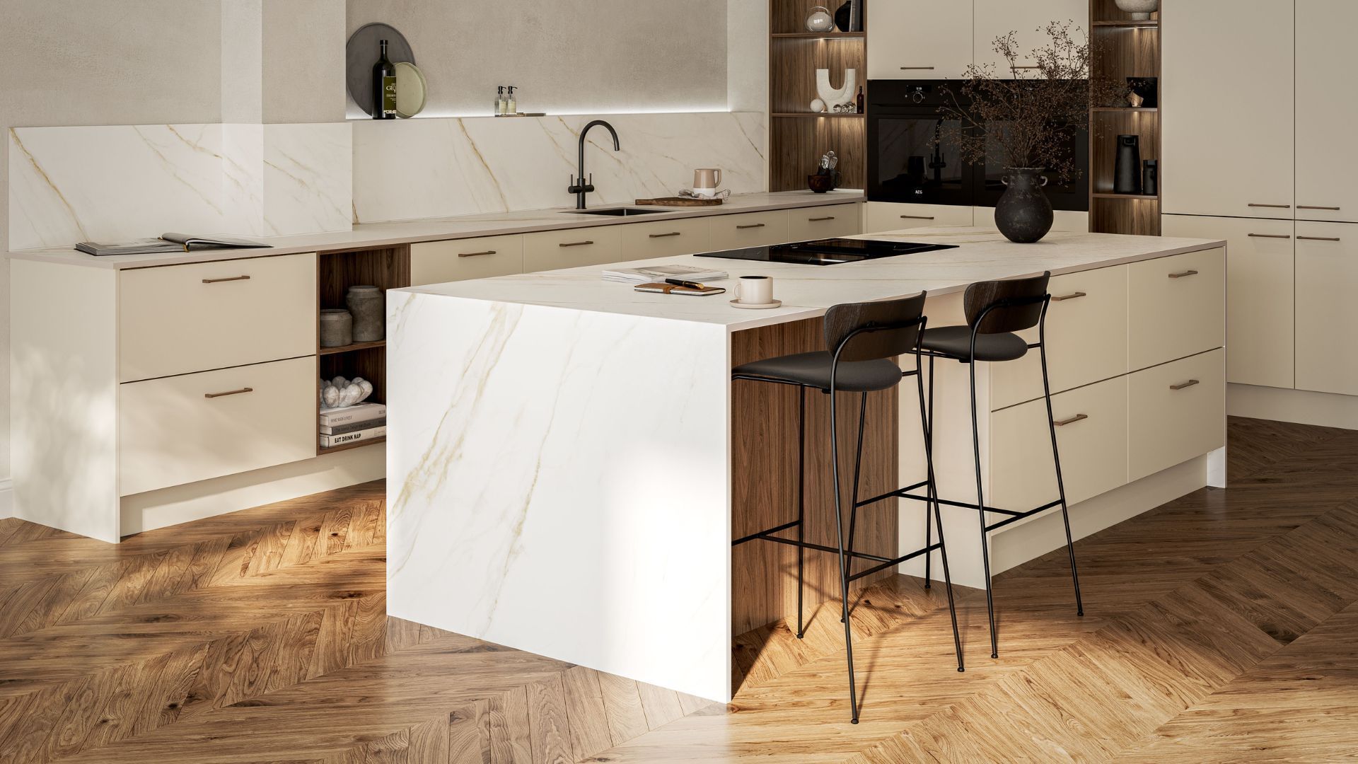 Modern kitchen with a white marble-topped island, light cream cabinets, wood accents, and herringbone flooring.