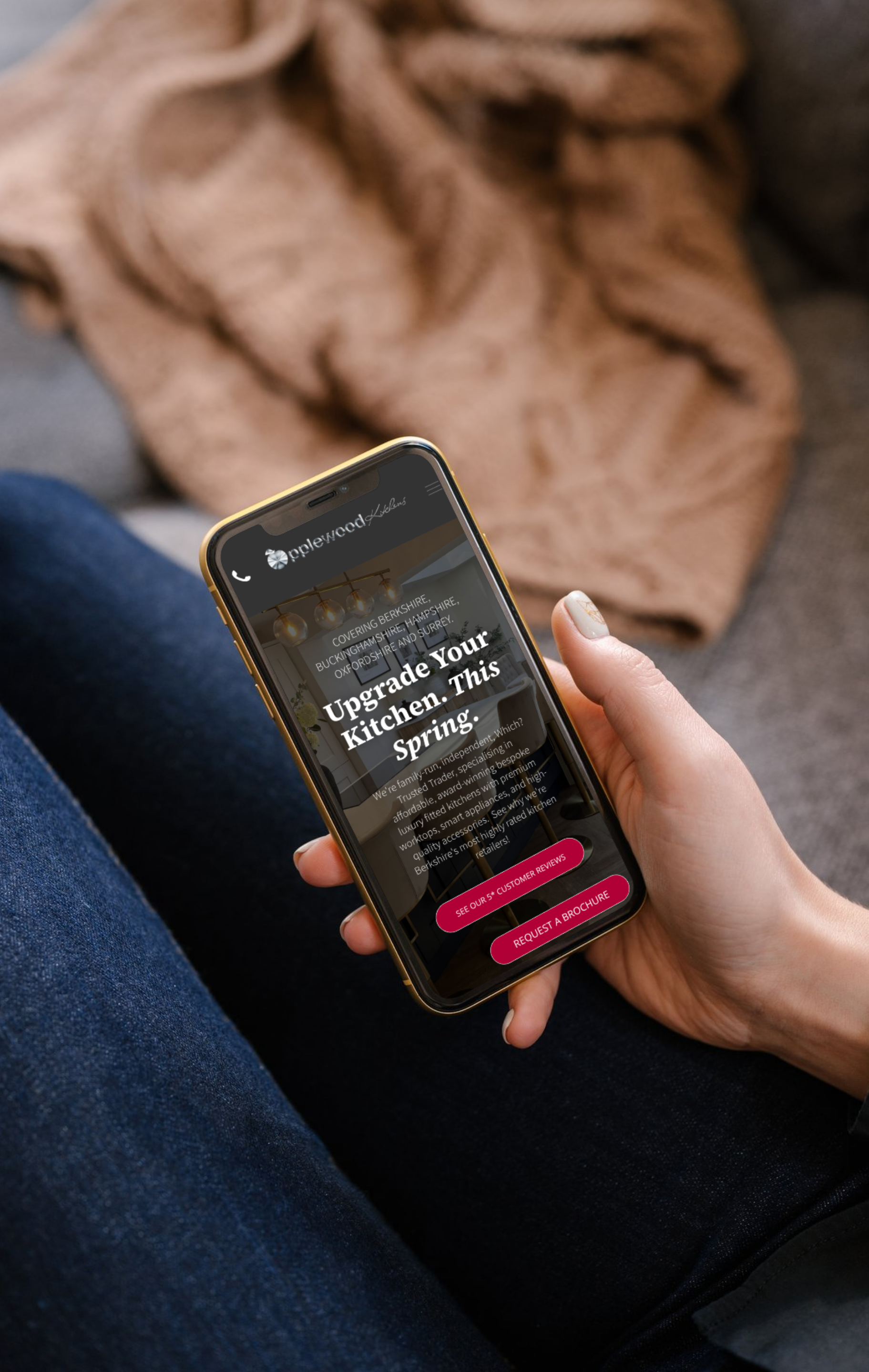 A hand holds a smartphone displaying a 