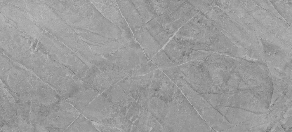 A light gray surface with a marble-like pattern of subtle, intersecting thin white veins.
