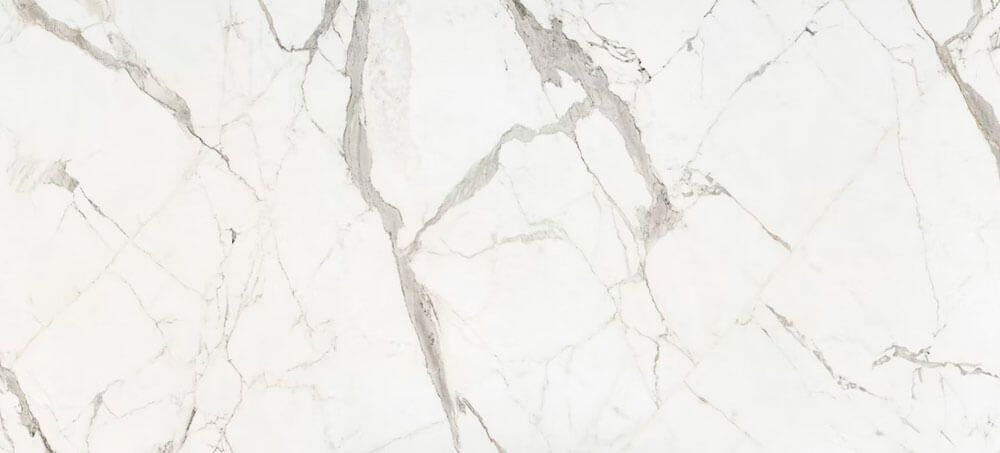 White marble texture with grey veins running throughout the surface.