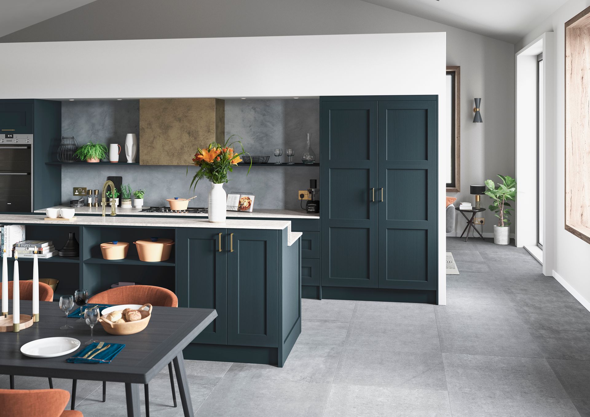 A modern kitchen featuring dark blue cabinets, a central island with bar seating, and gray stone floors.