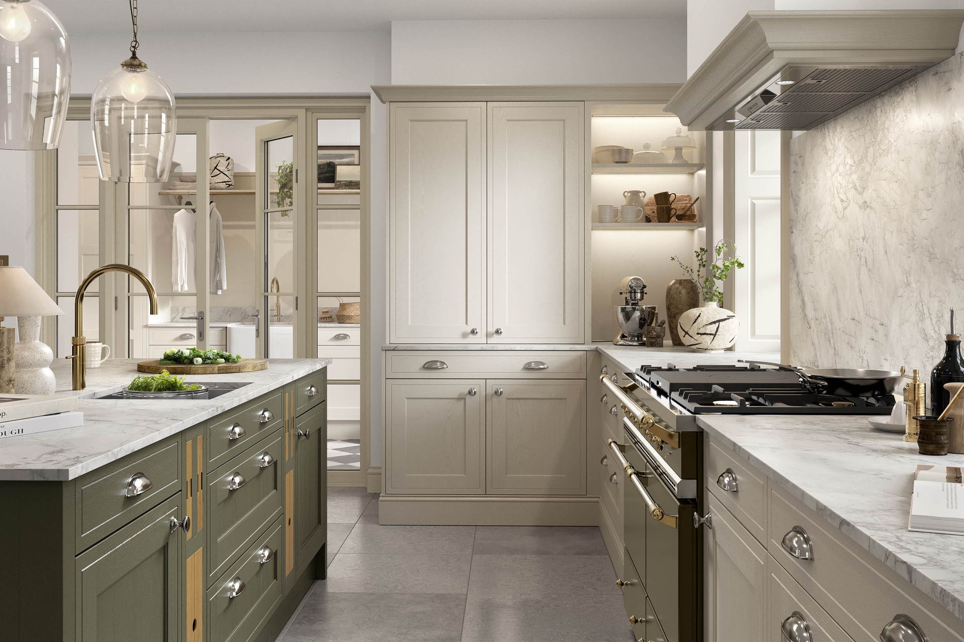 A modern, elegant kitchen with sage green cabinets, a marble countertop, an island, and high-end stainless steel appliances.