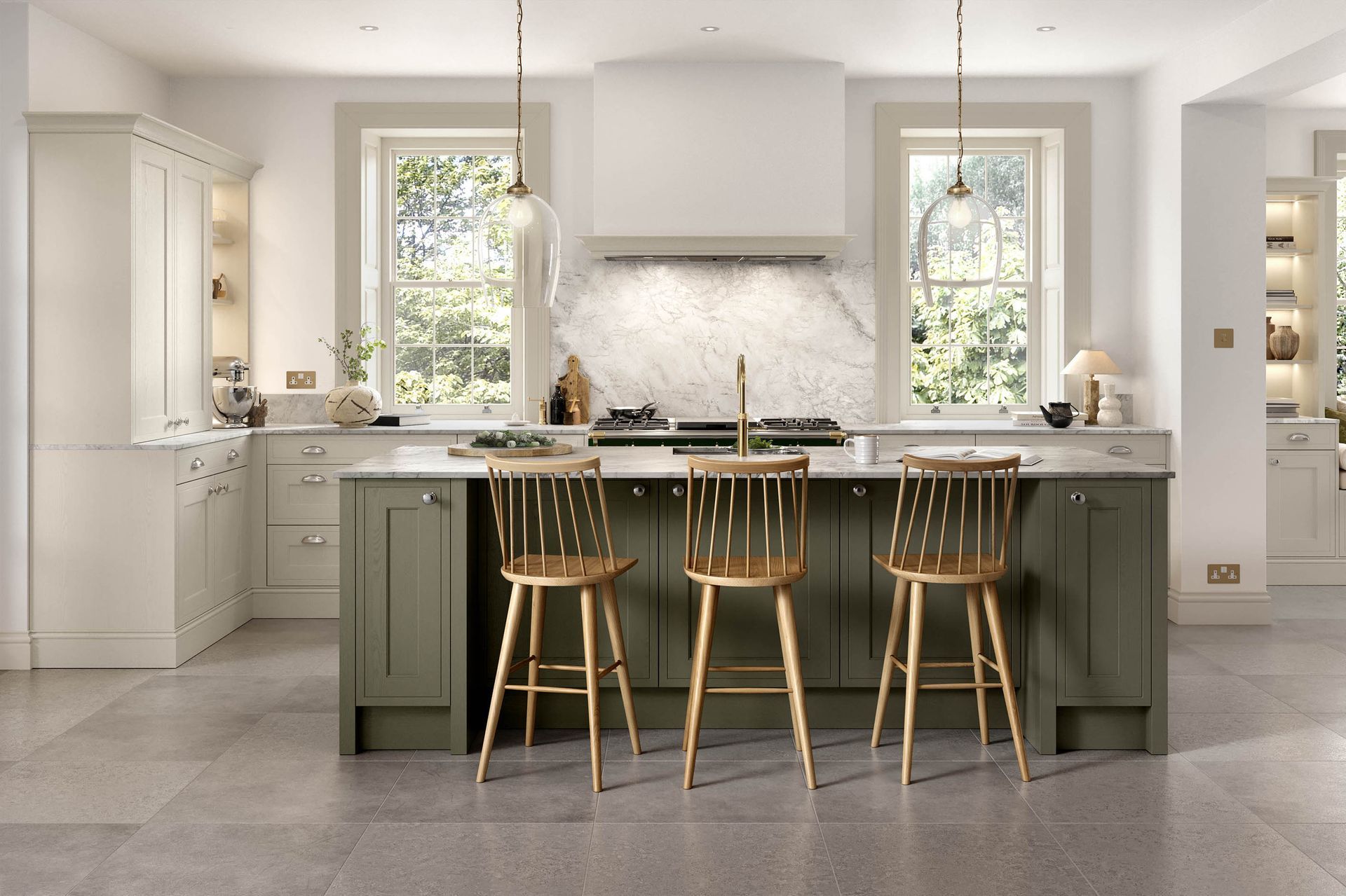 A kitchen featuring an olive green island with three wooden stools, cream cabinets, and a white marble backsplash.