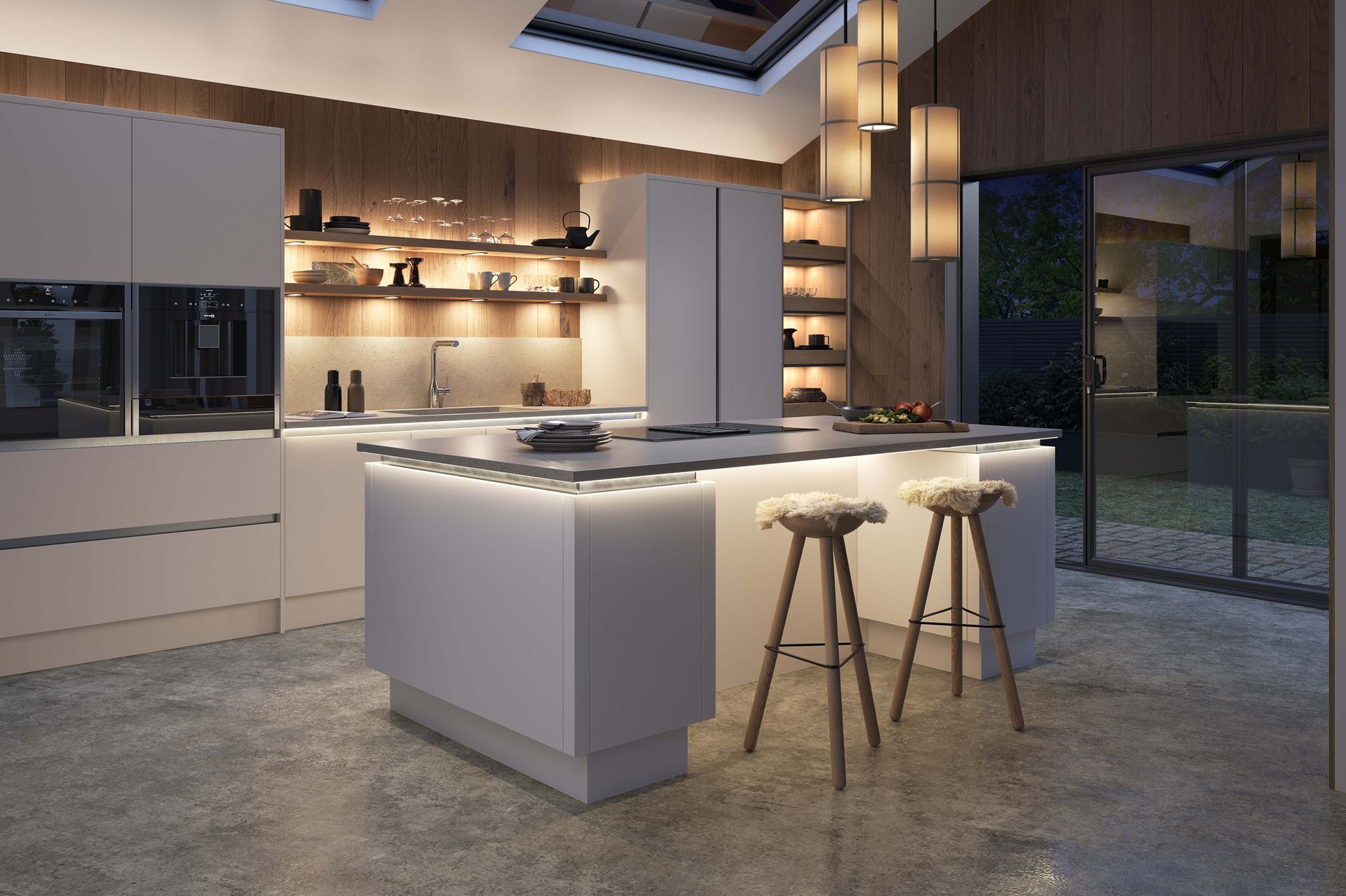Modern kitchen with a central white island, two wooden bar stools, and minimalist lighting against warm wooden cabinetry.