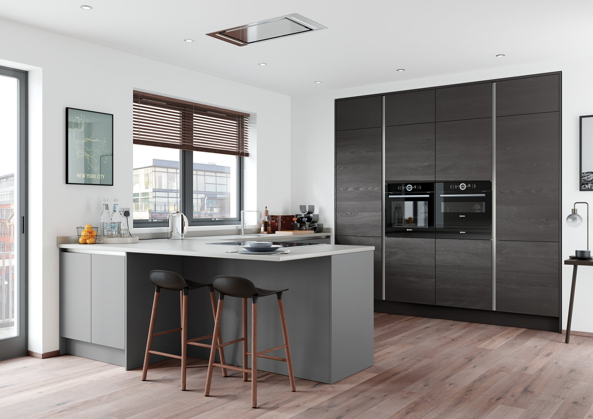 Modern kitchen with dark cabinetry, a light-colored island, two black bar stools, and wooden flooring.