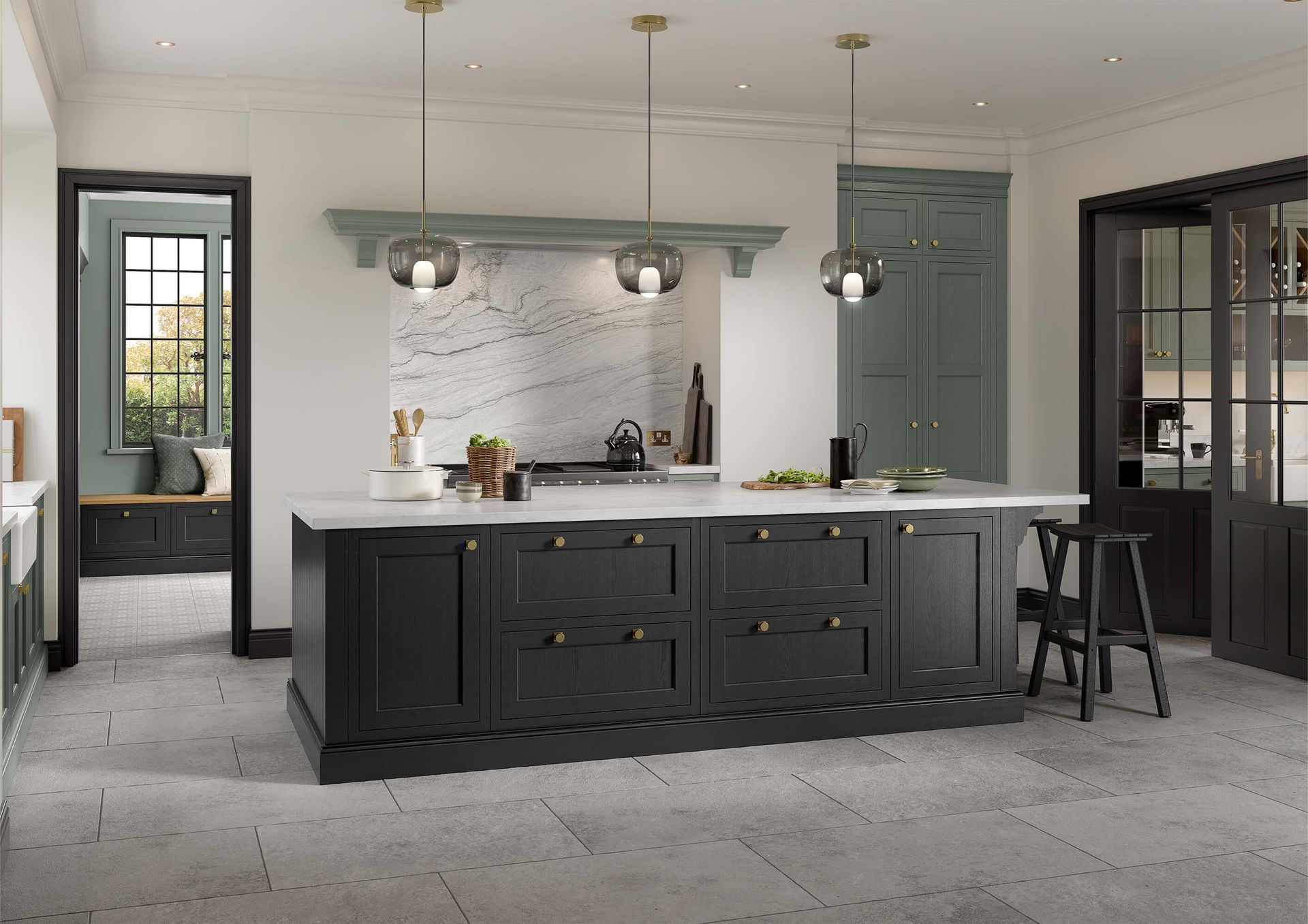 A modern kitchen with a large black island, white marble countertop, three pendant lights, and dark green cabinetry.
