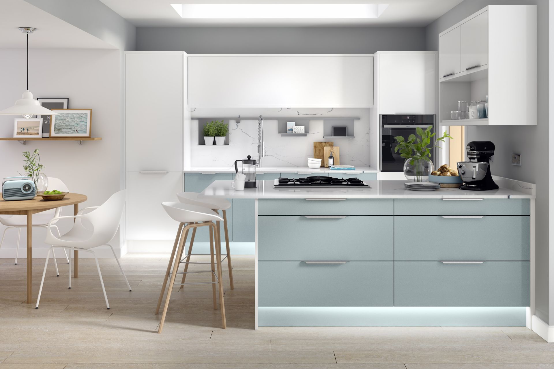 Modern kitchen featuring light blue island cabinets, white upper cabinets, stainless steel appliances, and a dining area.