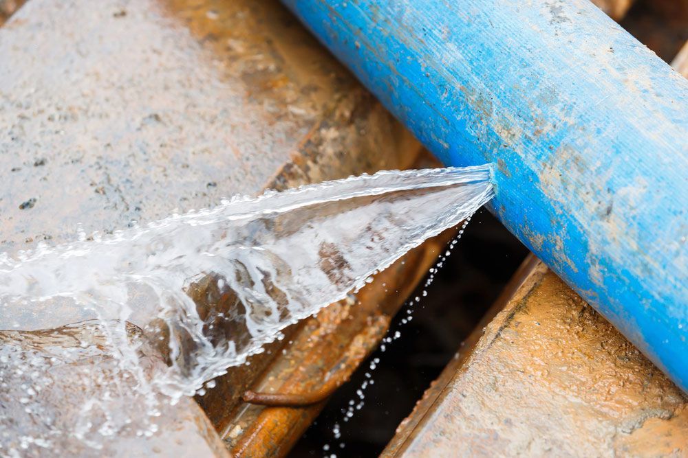Water is Leaking From Blue Pipe — Tim Larkin Plumbing and Excavations in Lake Cathie, NSW