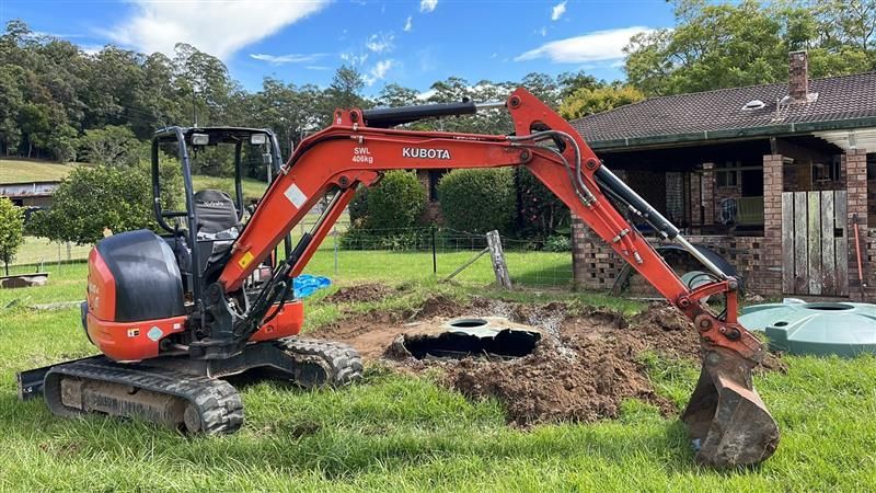 A Red Excavator — Tim Larkin Plumbing and Excavations in Bonny Hills, NSW