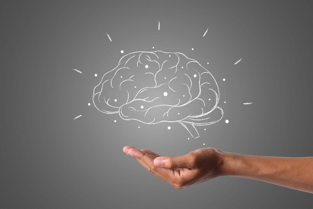 hand cupping a floating icon of a brain
