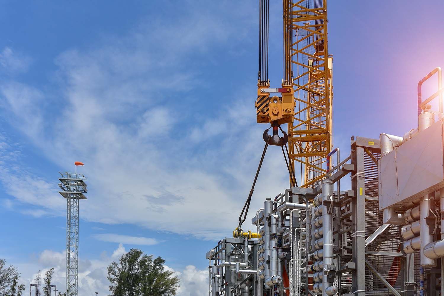Crane Lifting A Large Piece Of Equipment In An Oil Refinery — Calibre Engineering In Darwin, NT