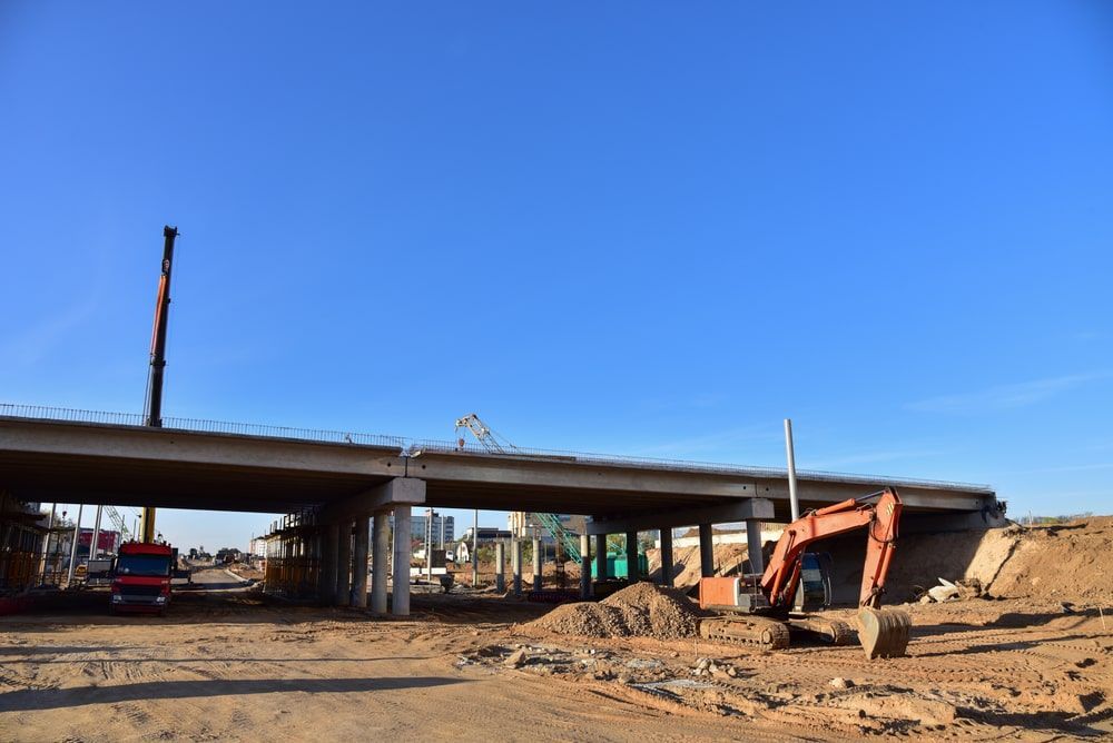 Construction Site With A Bridge Under Construction And A Crane — Calibre Engineering In Mackay, QLD
