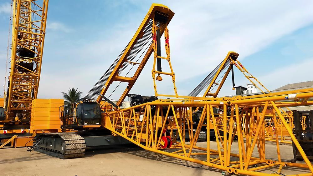 Large Yellow Crane Sitting On Top Of A Dirt Field — Calibre Engineering In Mackay, QLD