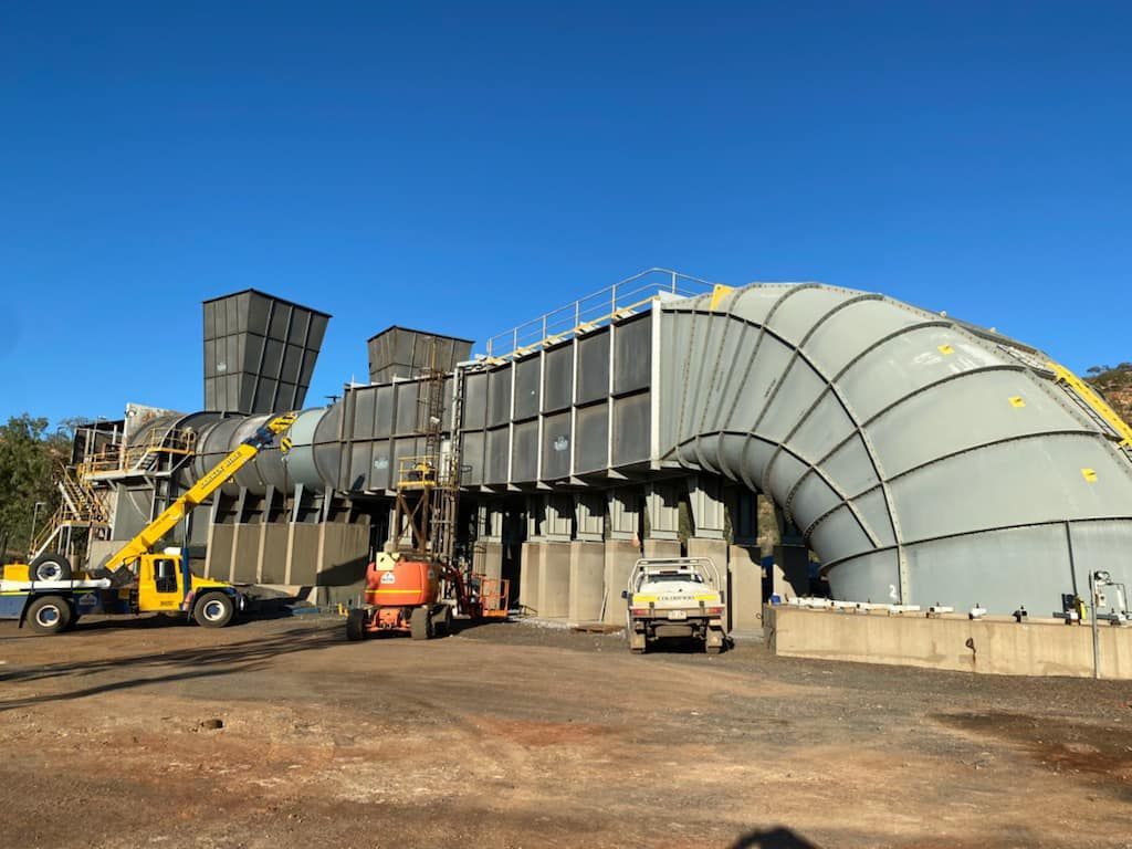 Large Pipe Being Built In Front Of A Building — Calibre Engineering In Mica Creak, QLD