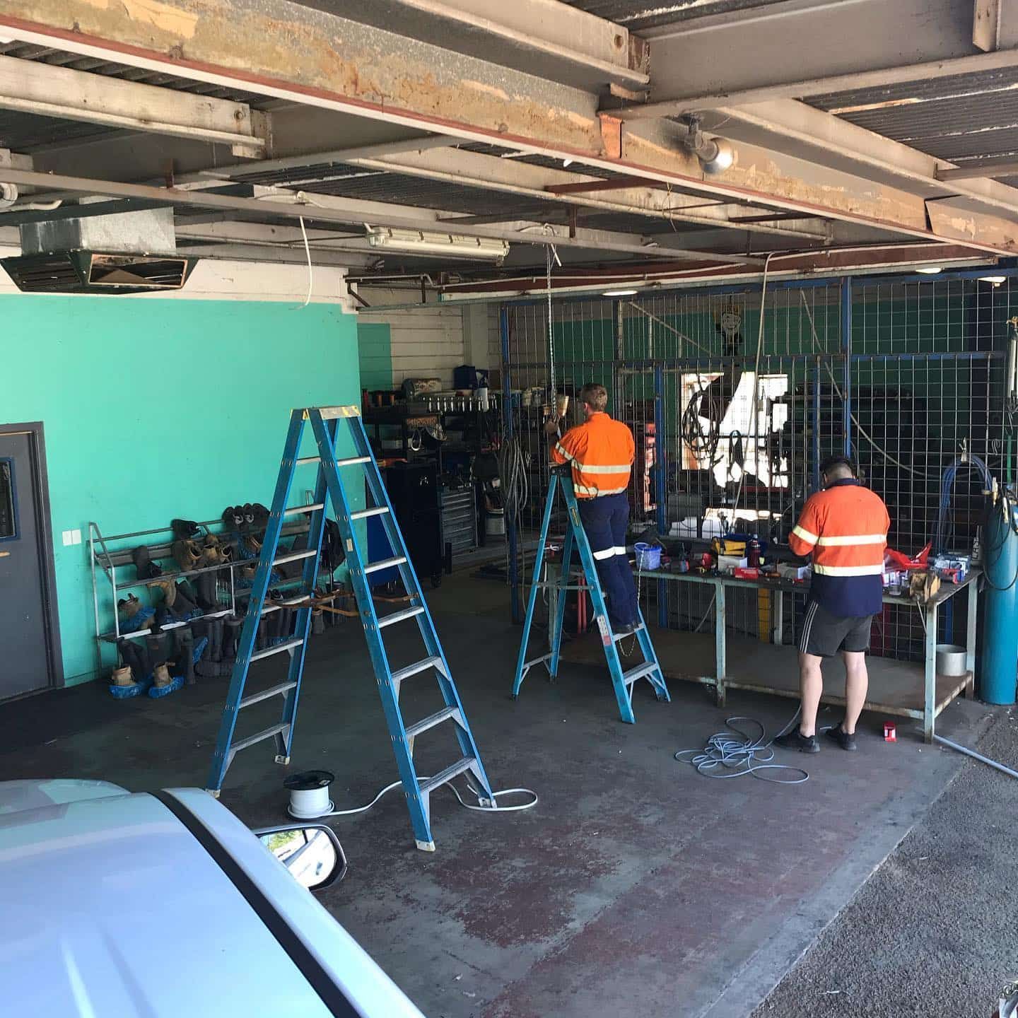 Group Of Men Working In A Garage With Ladders — Calibre Engineering In Mica Creak, QLD