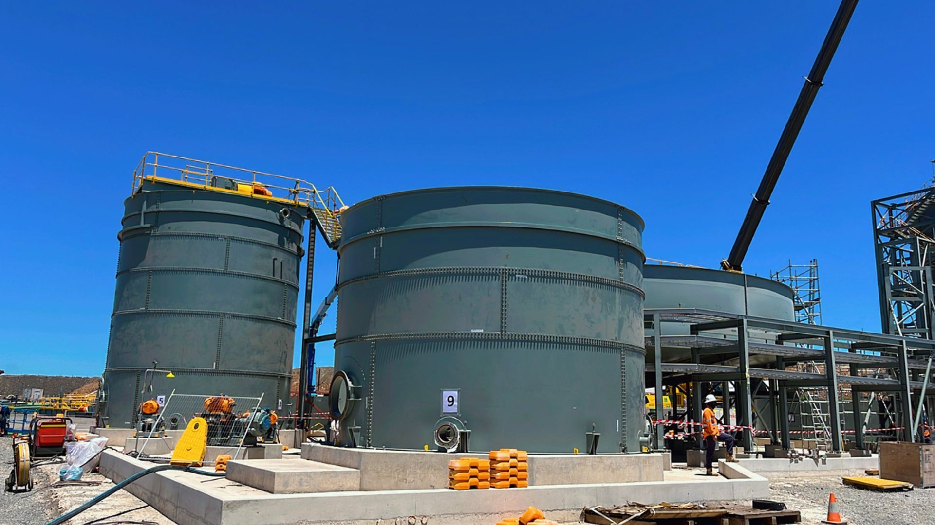 A large building under construction with a blue sky in the background — Calibre Engineering In Mica Creak, QLD
