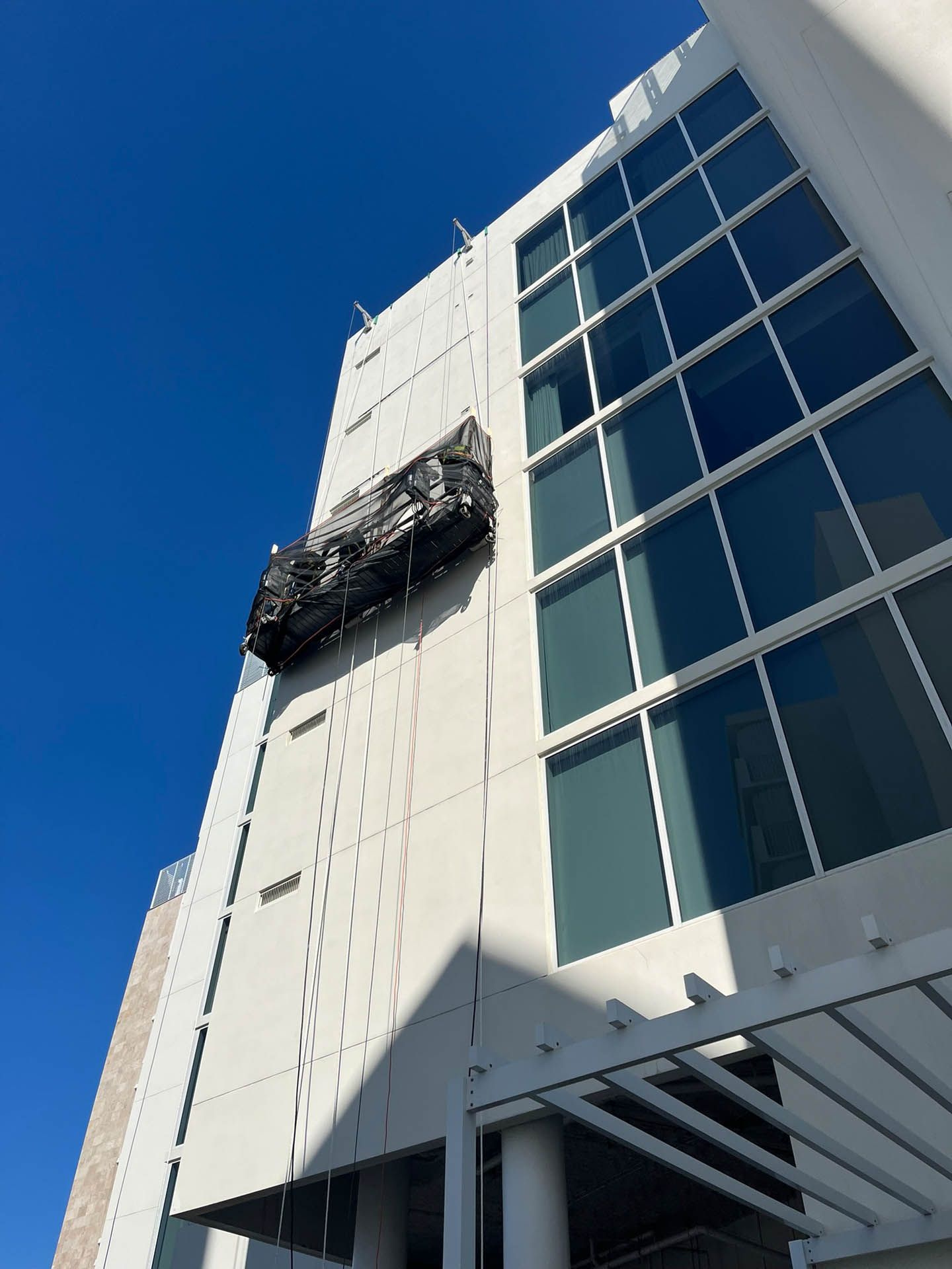 A large building with a lot of windows is being built.