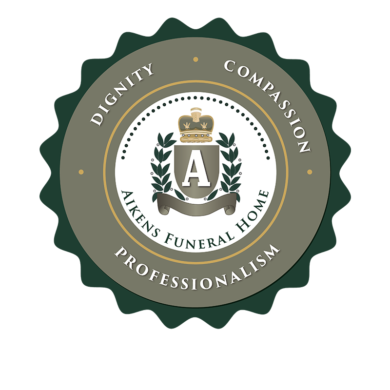 Logo for Aikens Funeral Home: Seal with crown, leaves, and text: dignity, compassion, professionalism.