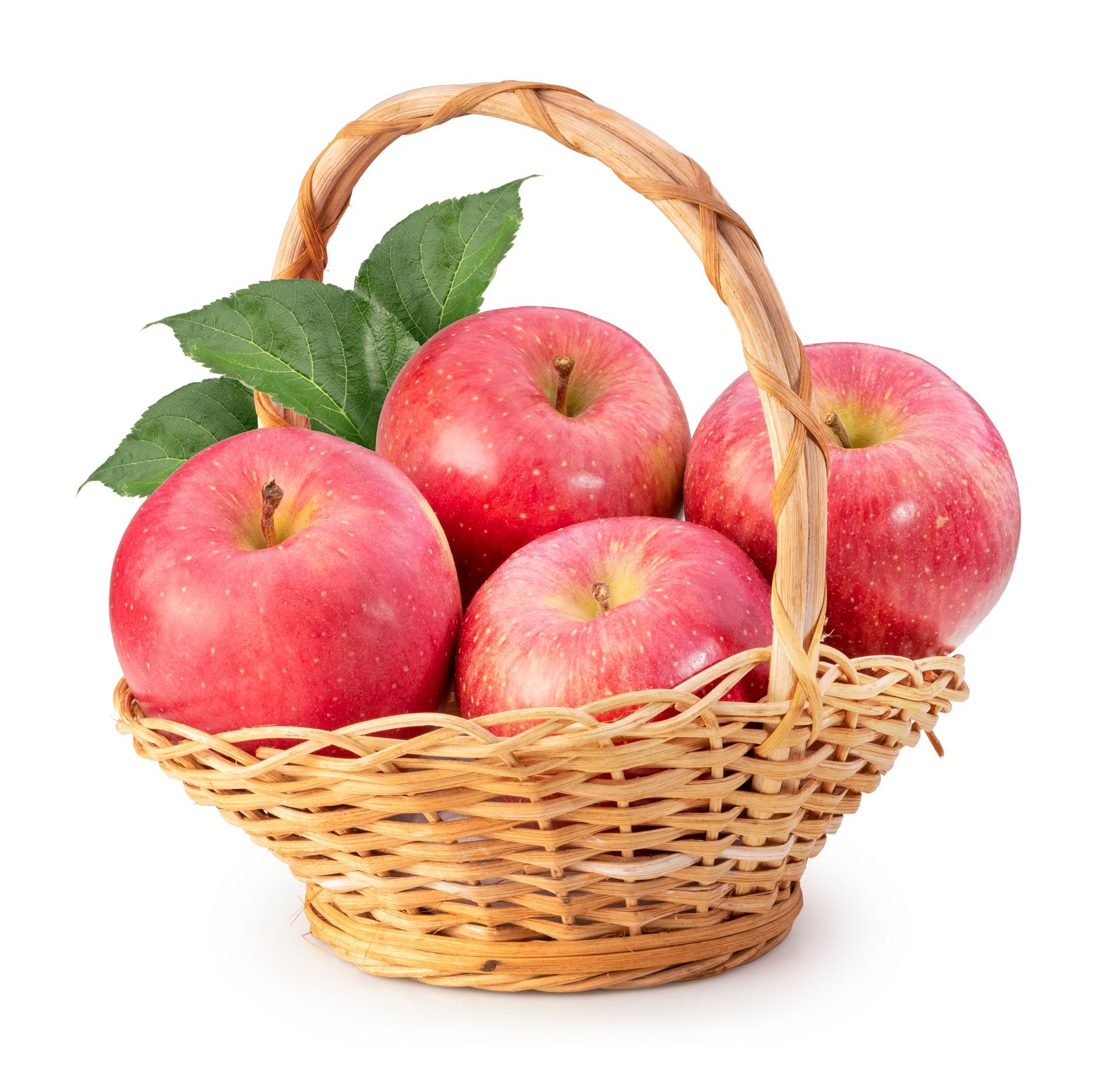 Basket filled with red apples and green leaves.