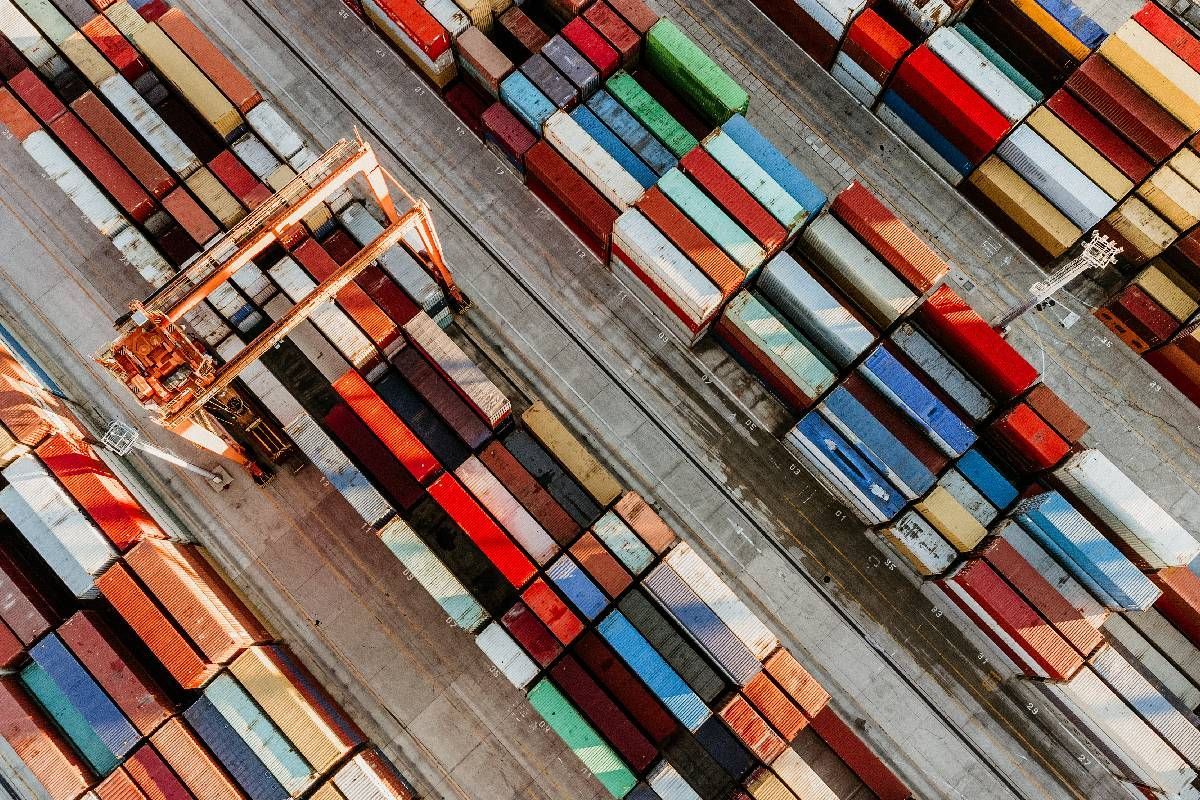 Aerial view of freight yard full of multicolored cargo containers