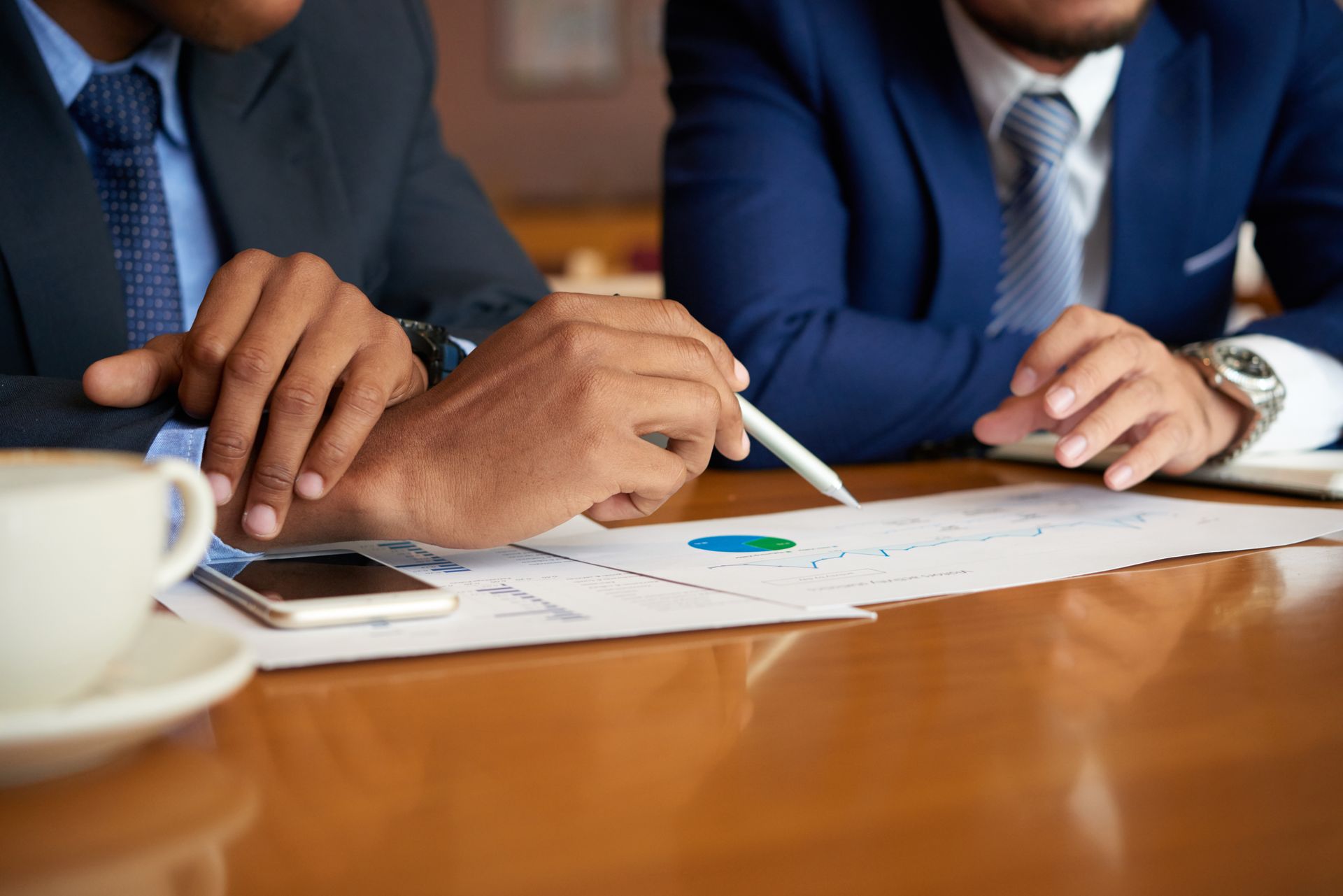Two professionals evaluating logistics partner performance.