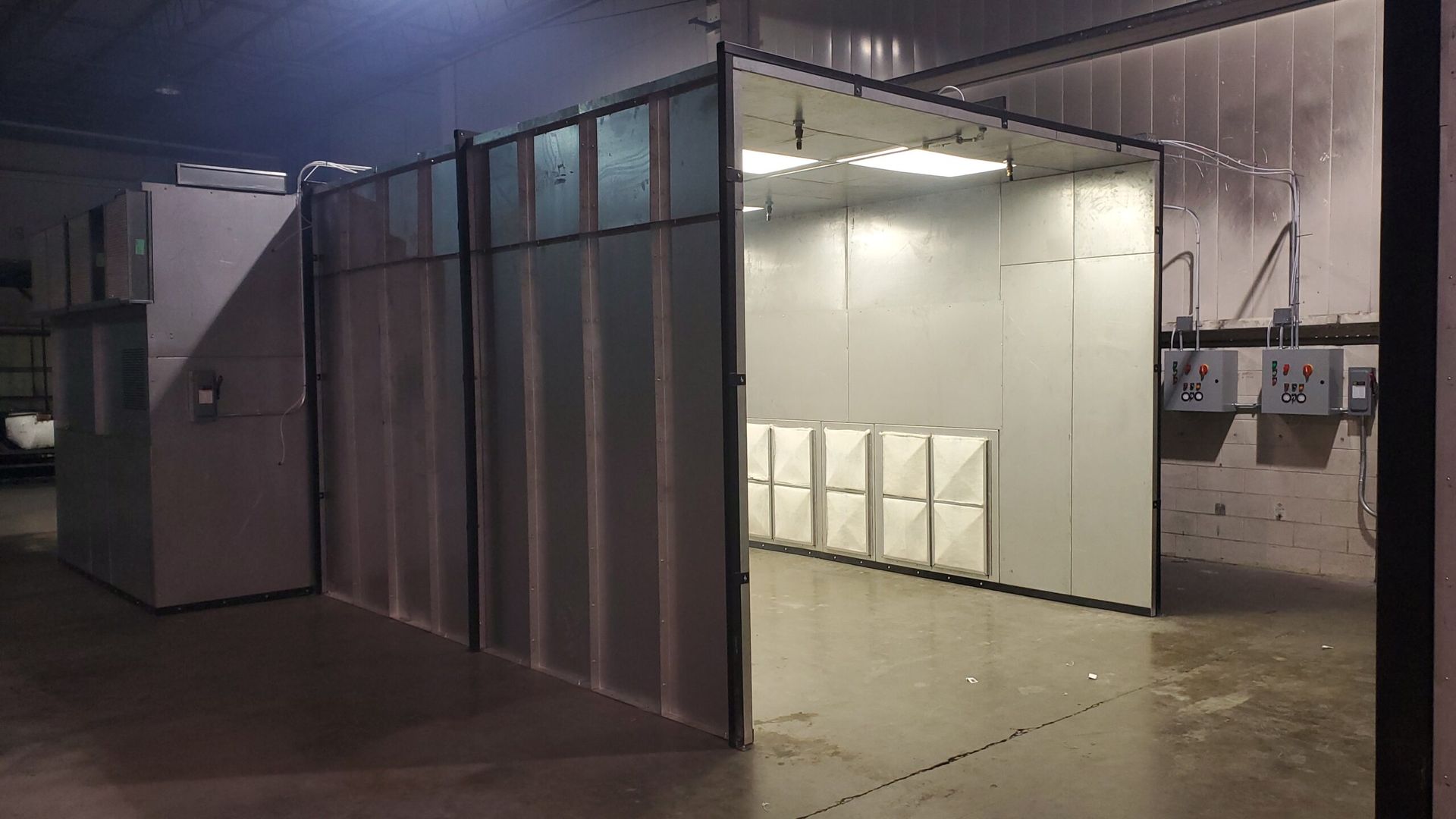 A professional powder coating booth used for applying electrostatic powder coatings.