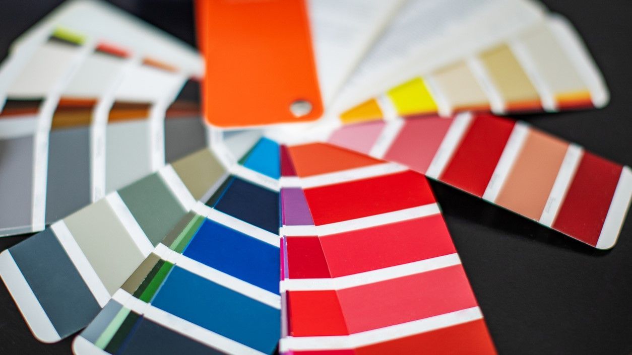 An RAL color fan deck showcasing different powder coating colors.