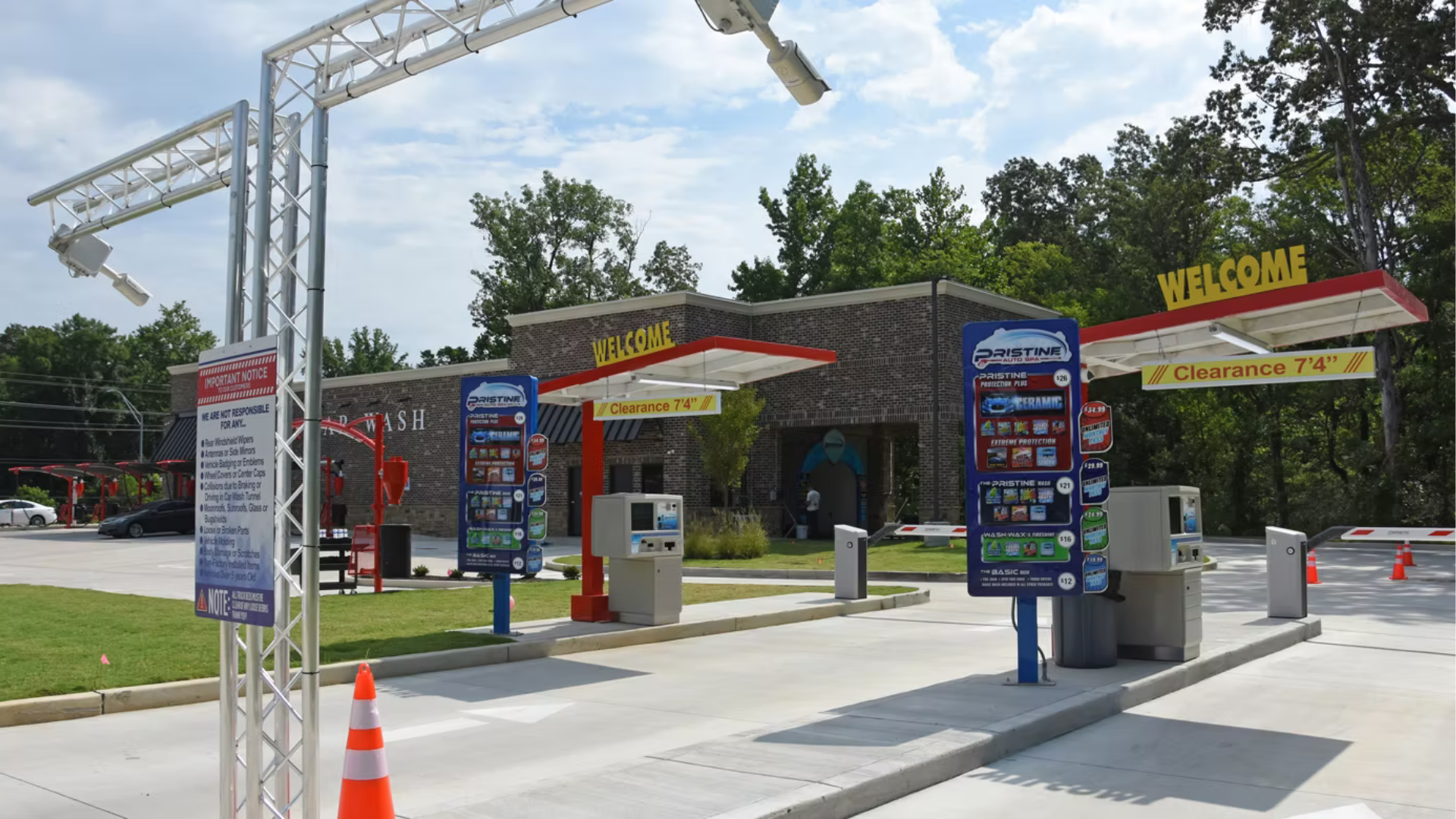 A car wash with a sign that says welcome on it