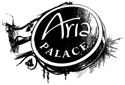 A circular black and white sign hanging from a bracket that reads