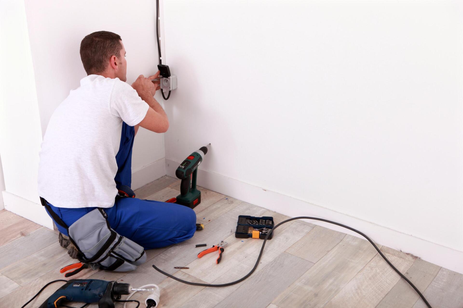 man fixing the electrical wires