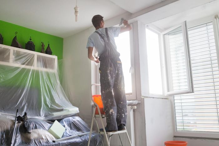 worker painting the walls