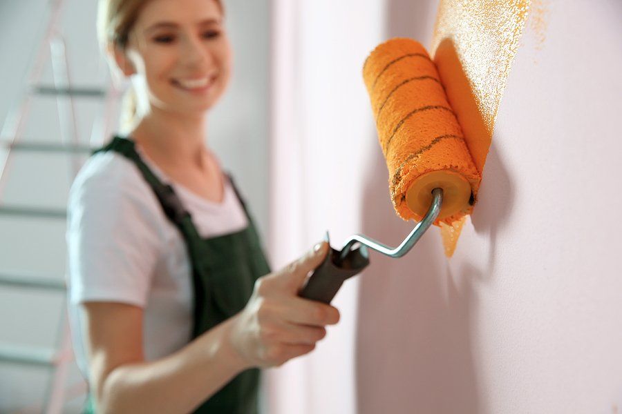 woman painting the walls