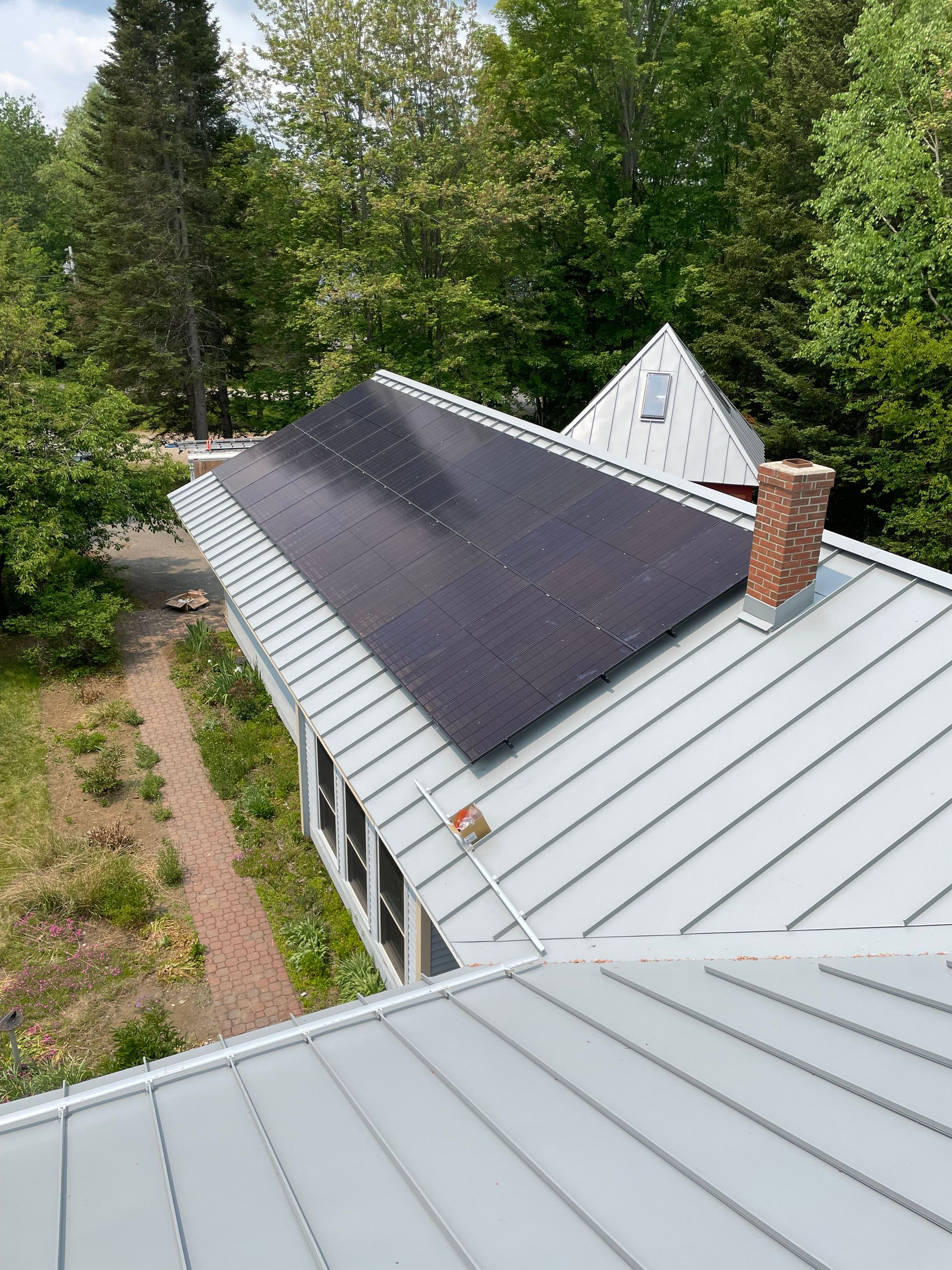 A residential roof with solar panels installed