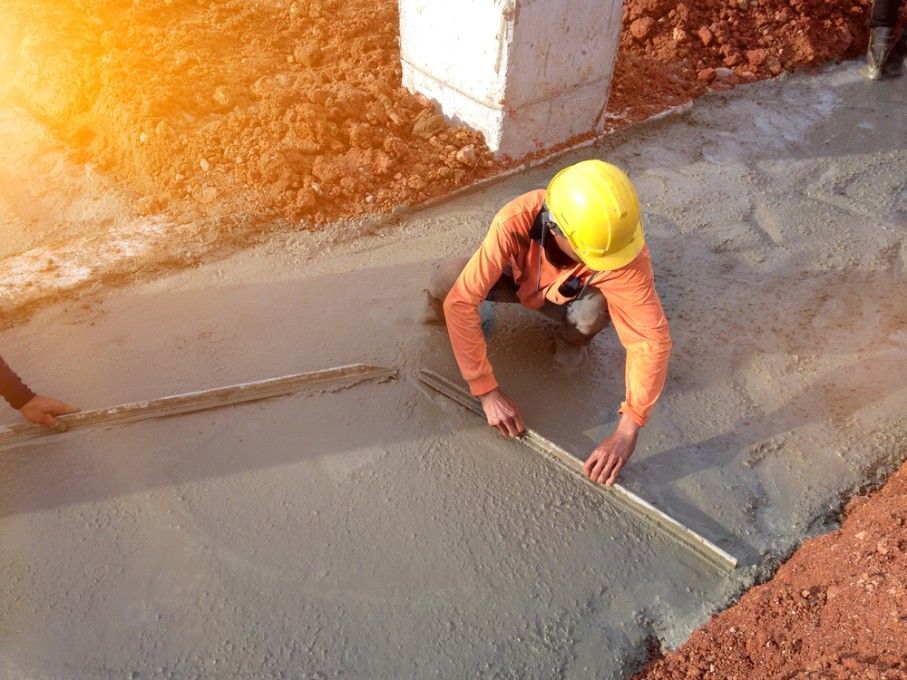 A Construction Worker is Levelling Concrete — Fud's Concreting In Proserpine, QLD