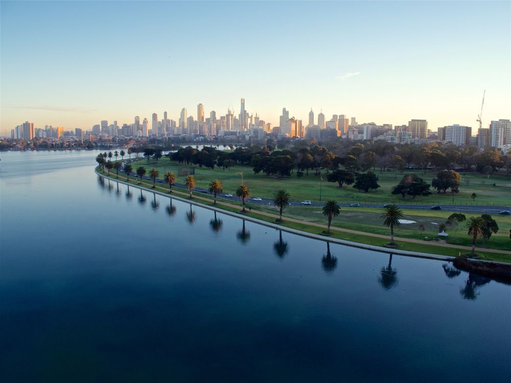 City Skyline Across A Calm River At Sunset  — Arctic Installations in Melbourne, VIC