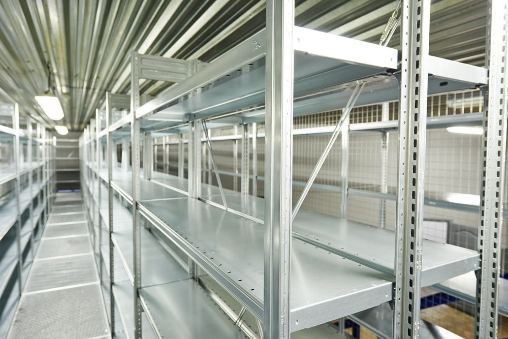 A Long Row of Empty Shelves in A Warehouse — Arctic Installations in East Arm, NT